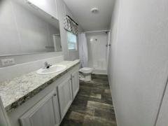 Photo 3 of 11 of home located at 13618 N. Florida Avenue Lot #64 Tampa, FL 33613