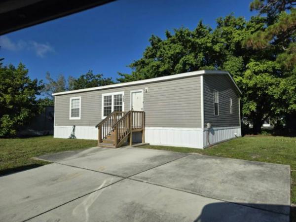 Photo 1 of 2 of home located at 100 Lisa Lane Greenacres, FL 33463