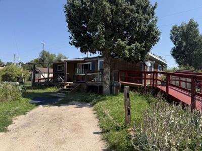 Photo 2 of 51 of home located at 695 Highway 105, Lot A-11 Palmer Lake, CO 80133