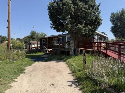 Photo 4 of 51 of home located at 695 Highway 105, Lot A-11 Palmer Lake, CO 80133