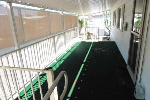 Large covered deck with steel ramp