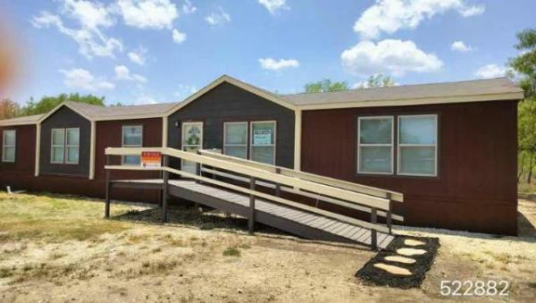 Photo 1 of 2 of home located at 211 N 8th St Christine, TX 78012