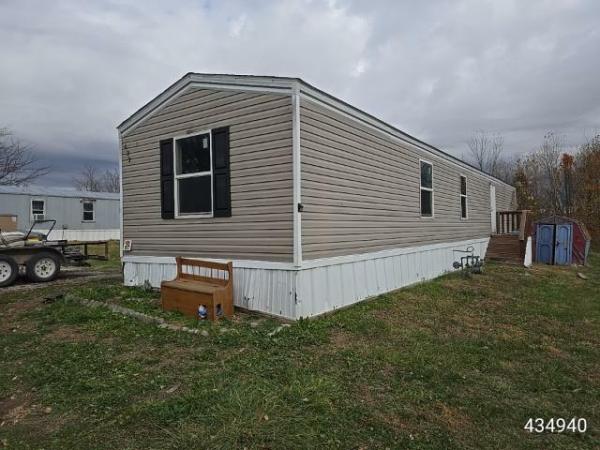 Photo 1 of 2 of home located at Maple Woods 610 E Orchard St Trlr 97 Odessa, MO 64076