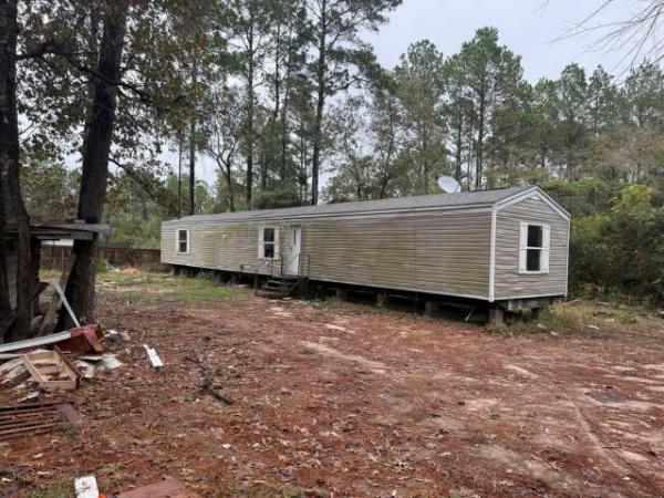 Photo 1 of 2 of home located at 8403 Mayhaw Ln Plantersville, TX 77363