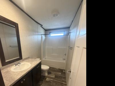 Photo 2 of 10 of home located at 836 Riverbend Lane Site 052 Middleville, MI 49333