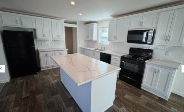 Photo 1 of 2 of home located at 1199 E Santa Fe, Lot # 323 Gardner, KS 66030